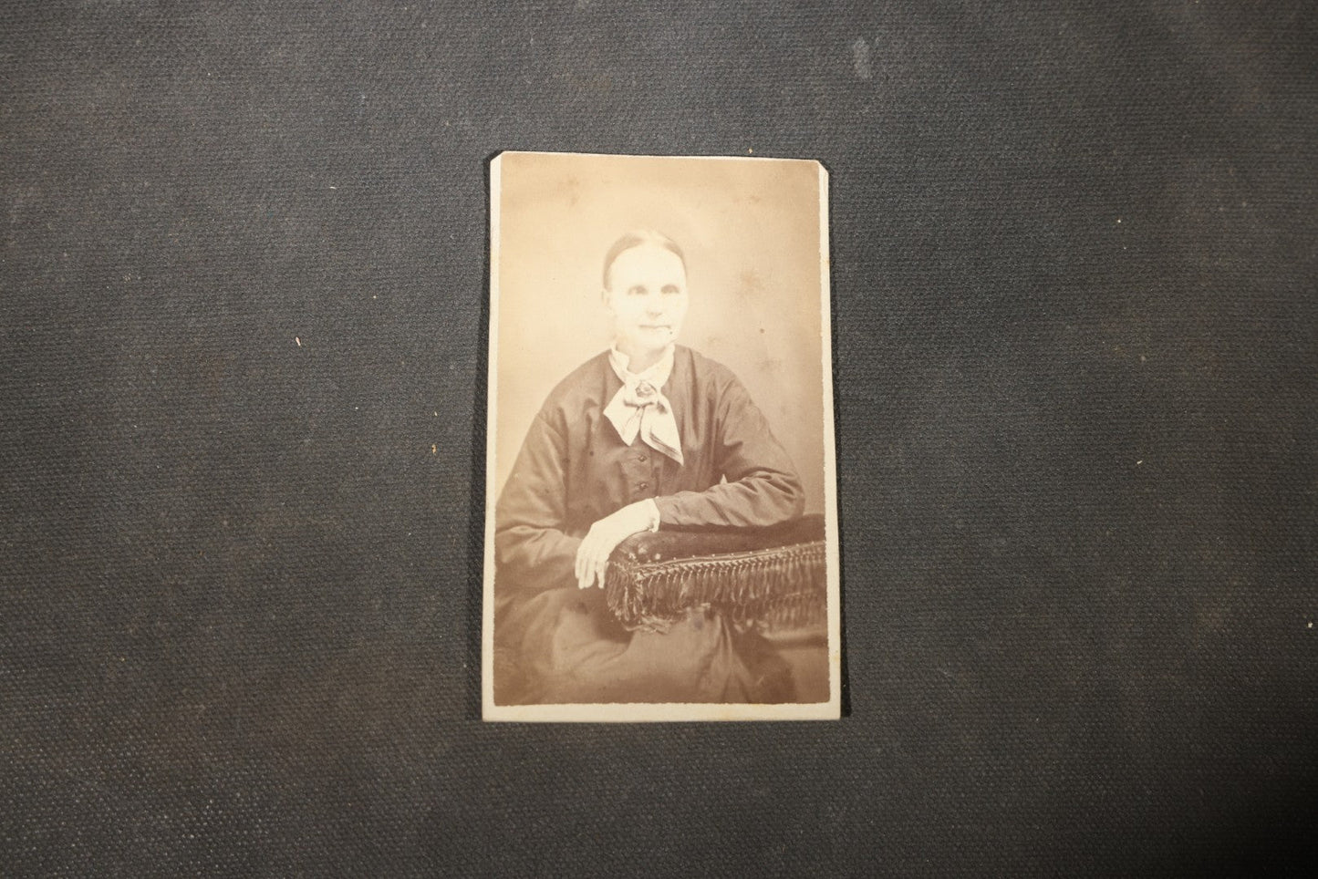 Grouping of 40+ Antique Photographs Including Carte De Visite C.D.V. Portraits, Tintype Photographs, and Board-Mounted Photographs, including young children, women with curled bangs, and more