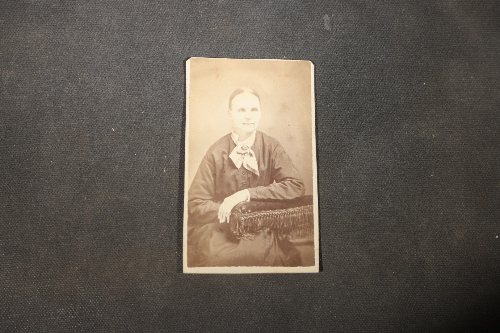Grouping of 40+ Antique Photographs Including Carte De Visite C.D.V. Portraits, Tintype Photographs, and Board-Mounted Photographs, including young children, women with curled bangs, and more