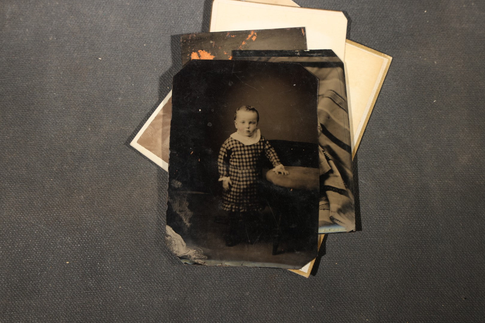 Grouping of 40+ Antique Photographs Including Carte De Visite C.D.V. Portraits, Tintype Photographs, and Board-Mounted Photographs, including young children, women with curled bangs, and more