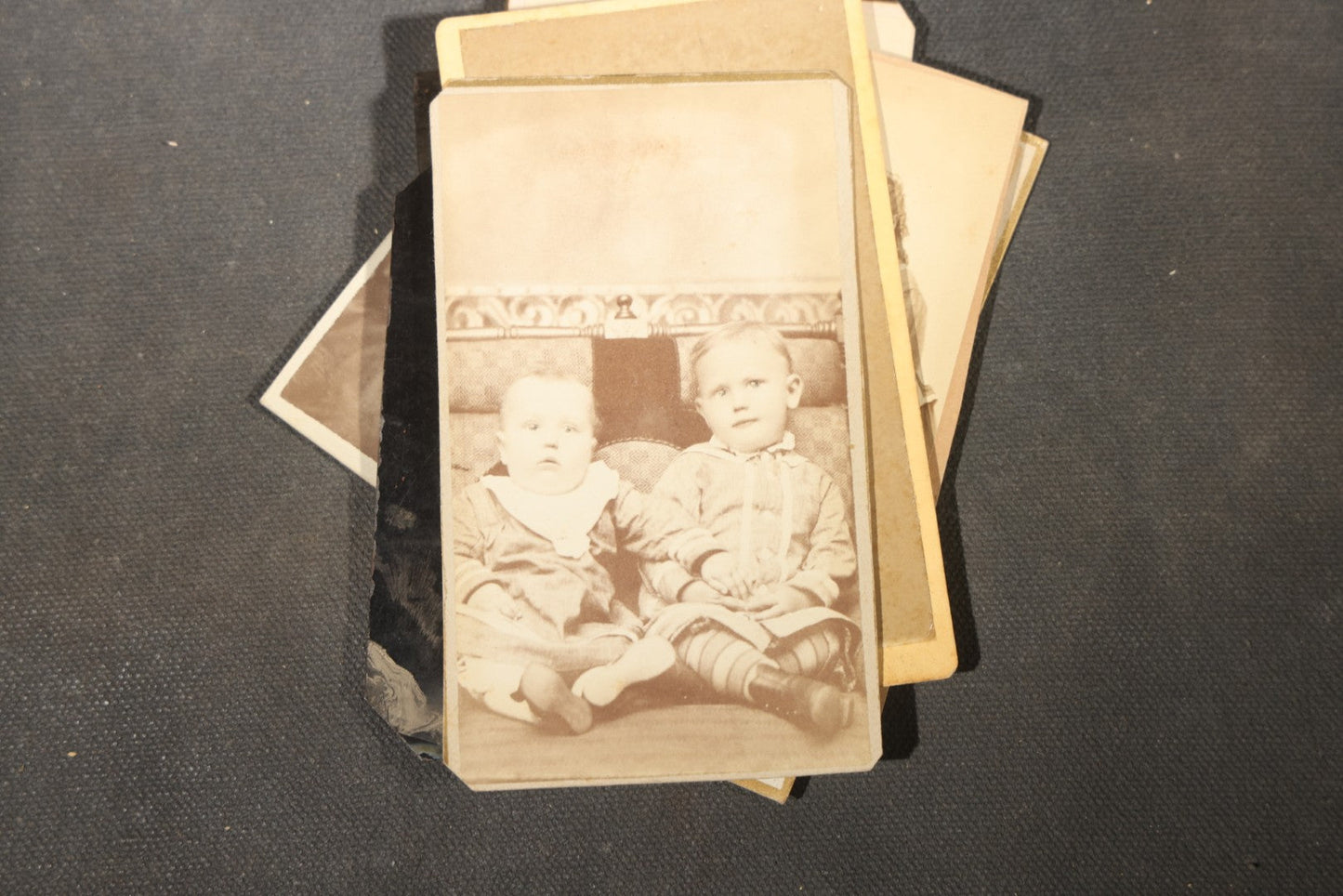 Grouping of 40+ Antique Photographs Including Carte De Visite C.D.V. Portraits, Tintype Photographs, and Board-Mounted Photographs, including young children, women with curled bangs, and more