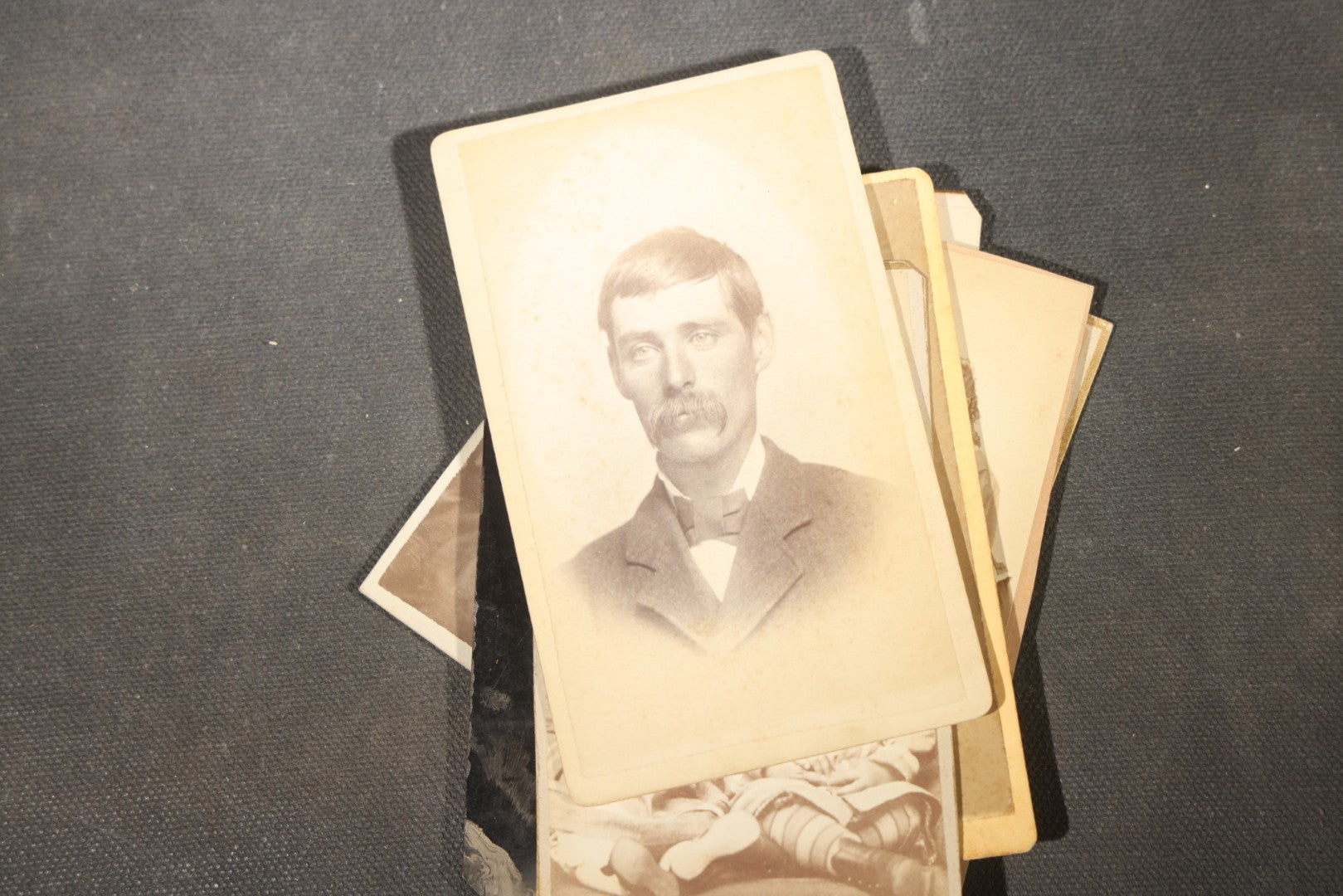 Grouping of 40+ Antique Photographs Including Carte De Visite C.D.V. Portraits, Tintype Photographs, and Board-Mounted Photographs, including young children, women with curled bangs, and more