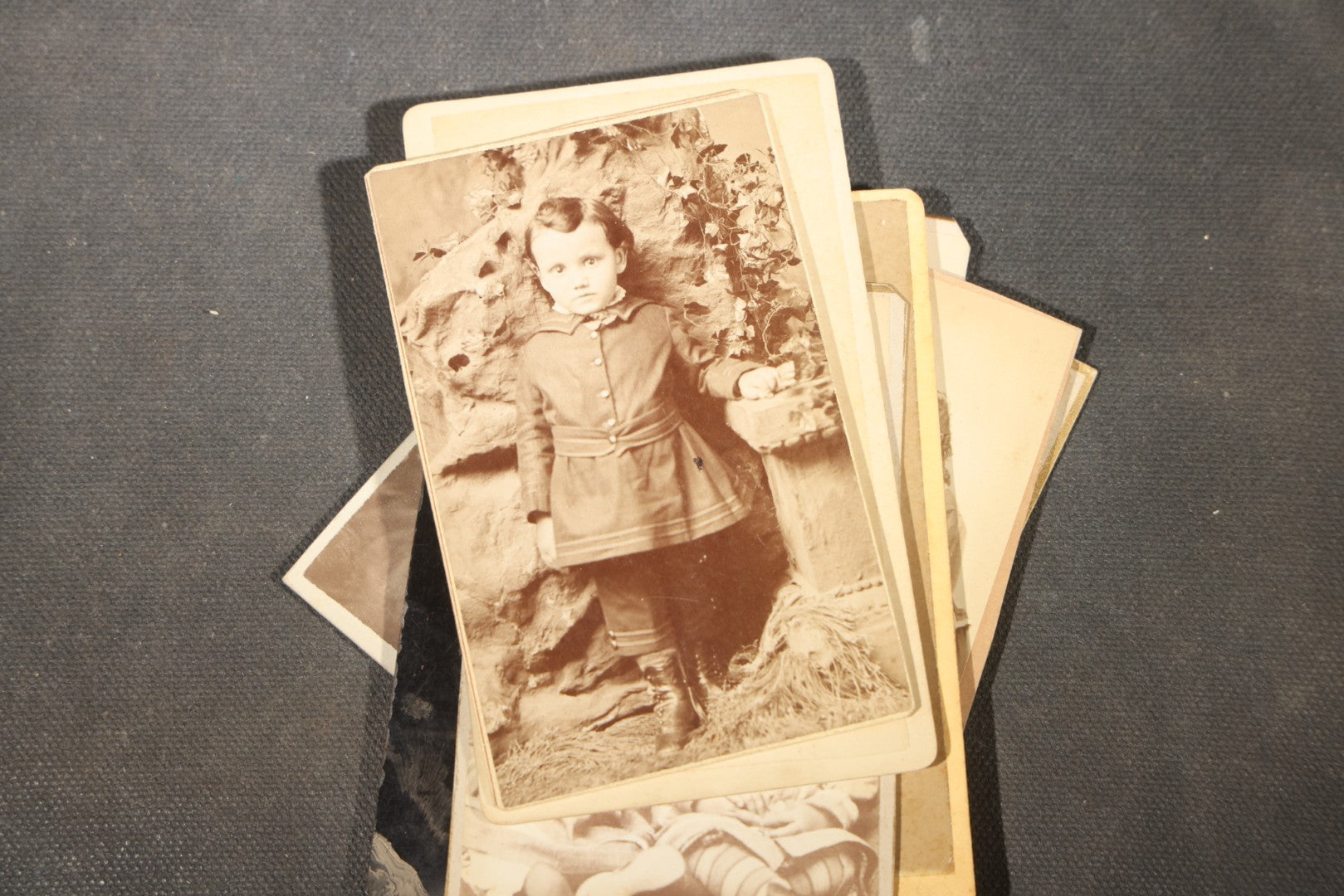 Grouping of 40+ Antique Photographs Including Carte De Visite C.D.V. Portraits, Tintype Photographs, and Board-Mounted Photographs, including young children, women with curled bangs, and more
