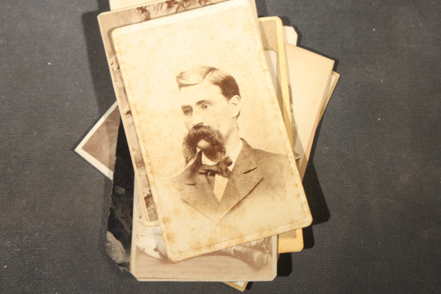 Grouping of 40+ Antique Photographs Including Carte De Visite C.D.V. Portraits, Tintype Photographs, and Board-Mounted Photographs, including young children, women with curled bangs, and more