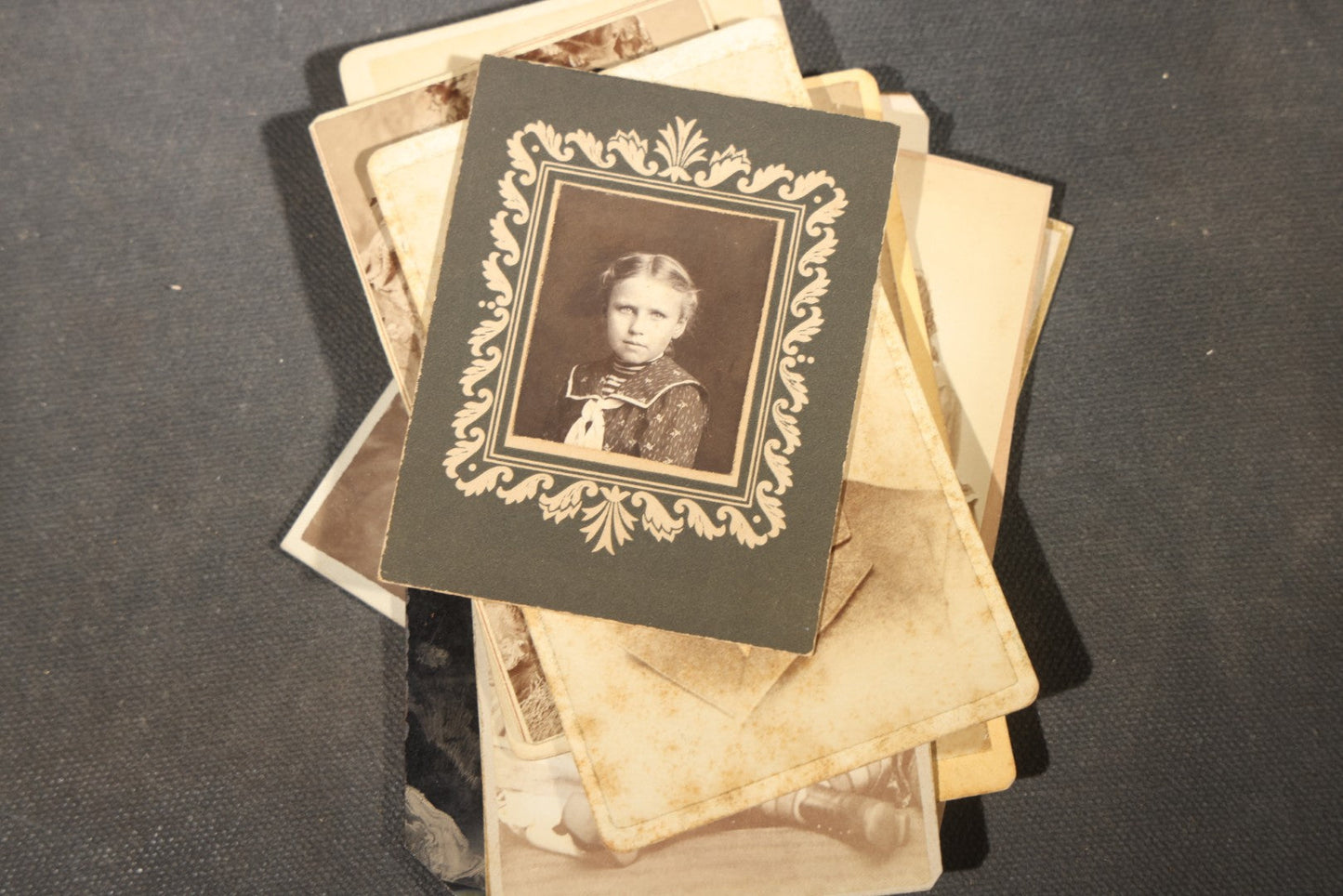 Grouping of 40+ Antique Photographs Including Carte De Visite C.D.V. Portraits, Tintype Photographs, and Board-Mounted Photographs, including young children, women with curled bangs, and more