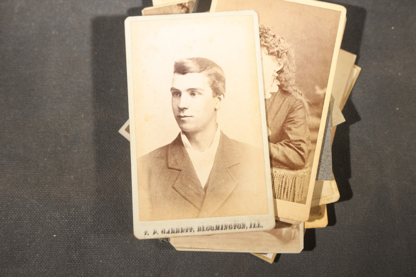 Grouping of 40+ Antique Photographs Including Carte De Visite C.D.V. Portraits, Tintype Photographs, and Board-Mounted Photographs, including young children, women with curled bangs, and more