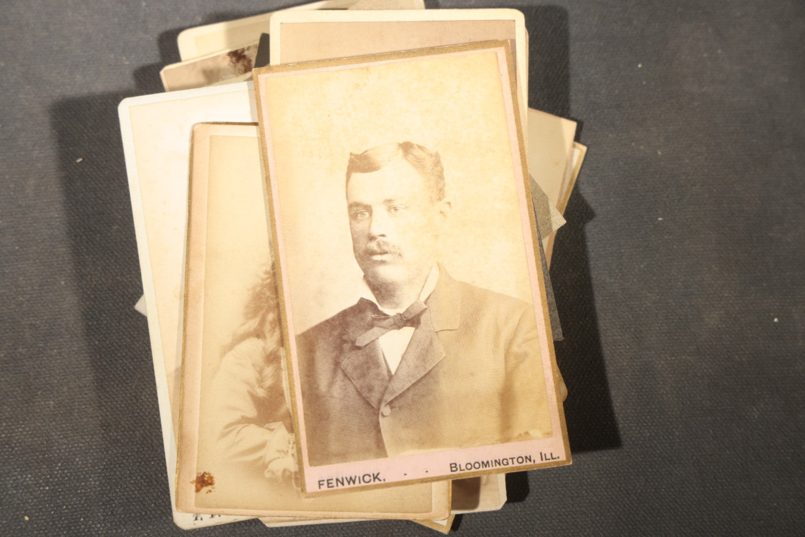 Grouping of 40+ Antique Photographs Including Carte De Visite C.D.V. Portraits, Tintype Photographs, and Board-Mounted Photographs, including young children, women with curled bangs, and more