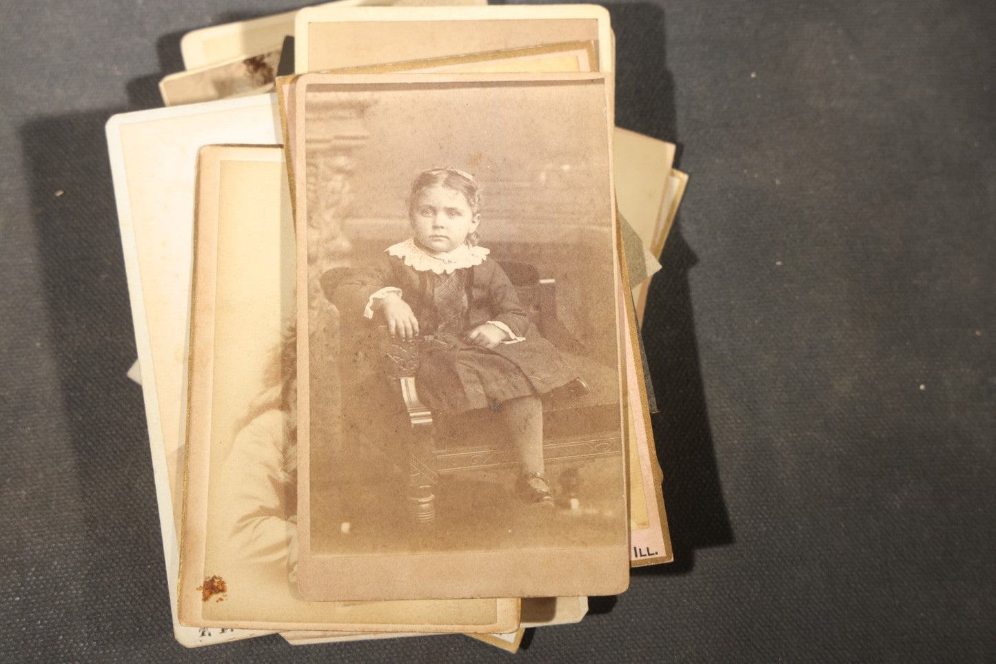 Grouping of 40+ Antique Photographs Including Carte De Visite C.D.V. Portraits, Tintype Photographs, and Board-Mounted Photographs, including young children, women with curled bangs, and more