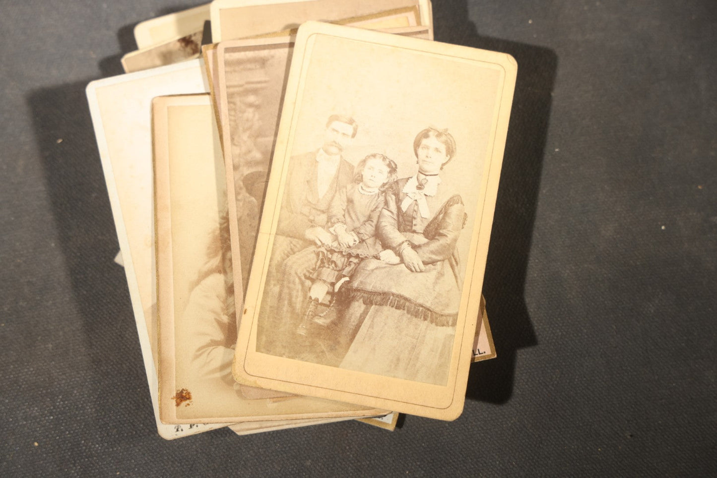 Grouping of 40+ Antique Photographs Including Carte De Visite C.D.V. Portraits, Tintype Photographs, and Board-Mounted Photographs, including young children, women with curled bangs, and more