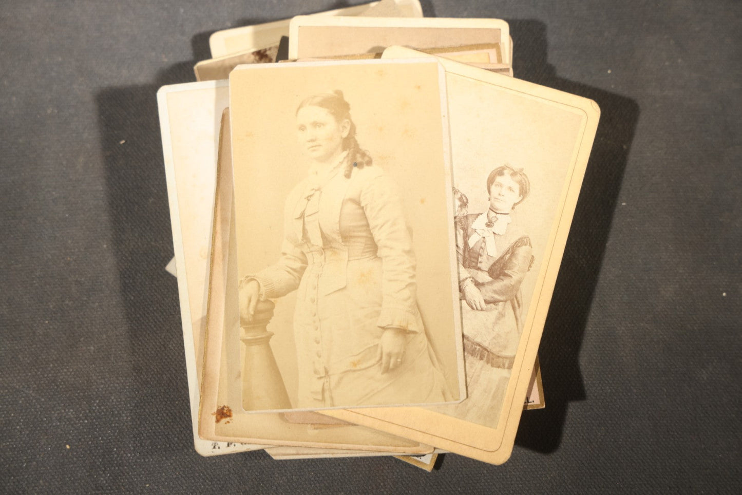 Grouping of 40+ Antique Photographs Including Carte De Visite C.D.V. Portraits, Tintype Photographs, and Board-Mounted Photographs, including young children, women with curled bangs, and more