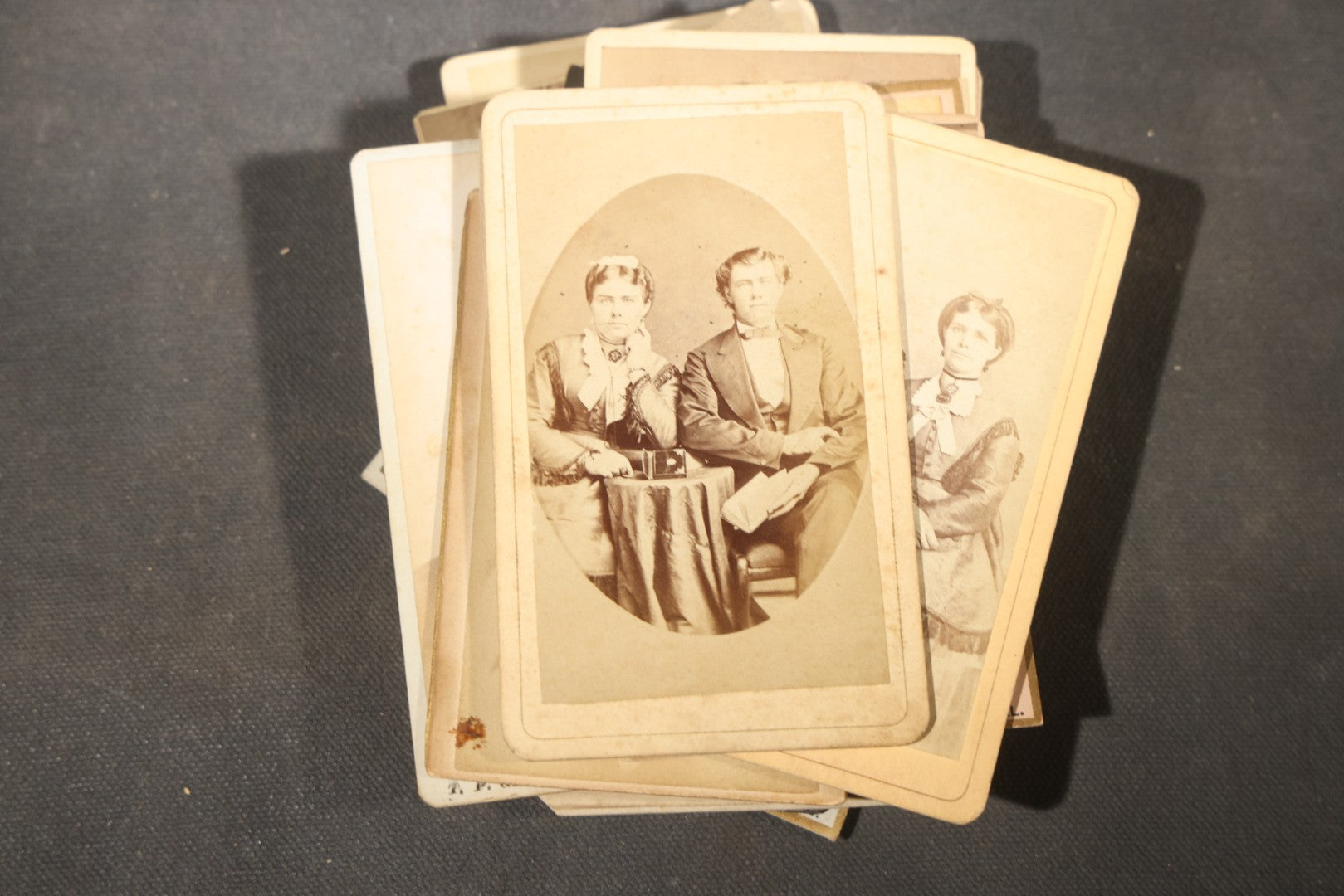 Grouping of 40+ Antique Photographs Including Carte De Visite C.D.V. Portraits, Tintype Photographs, and Board-Mounted Photographs, including young children, women with curled bangs, and more