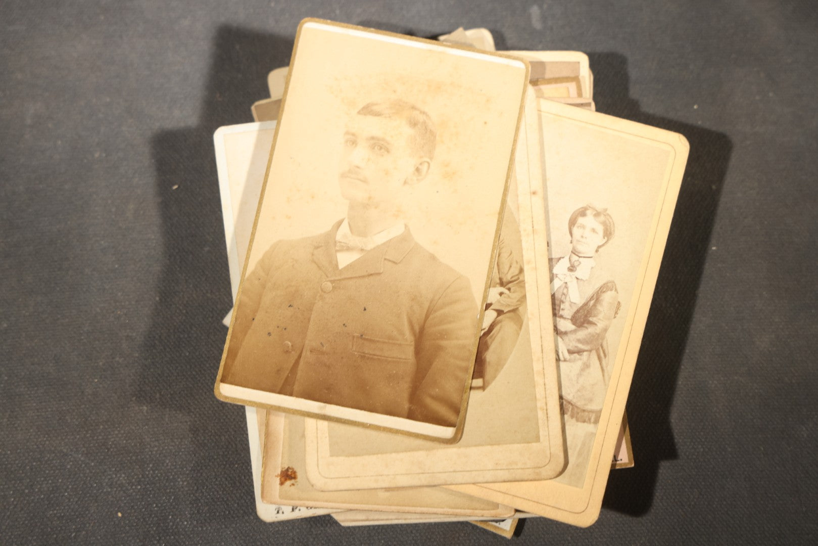 Grouping of 40+ Antique Photographs Including Carte De Visite C.D.V. Portraits, Tintype Photographs, and Board-Mounted Photographs, including young children, women with curled bangs, and more