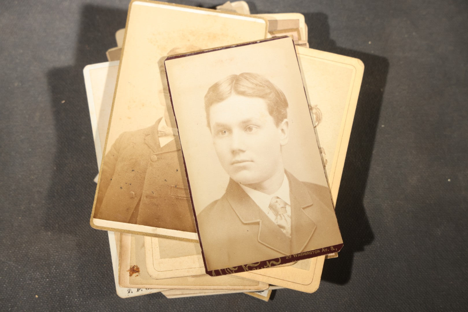 Grouping of 40+ Antique Photographs Including Carte De Visite C.D.V. Portraits, Tintype Photographs, and Board-Mounted Photographs, including young children, women with curled bangs, and more