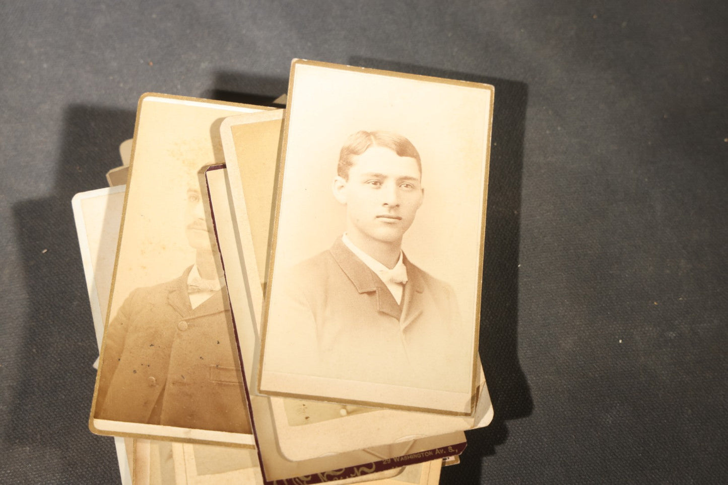 Grouping of 40+ Antique Photographs Including Carte De Visite C.D.V. Portraits, Tintype Photographs, and Board-Mounted Photographs, including young children, women with curled bangs, and more
