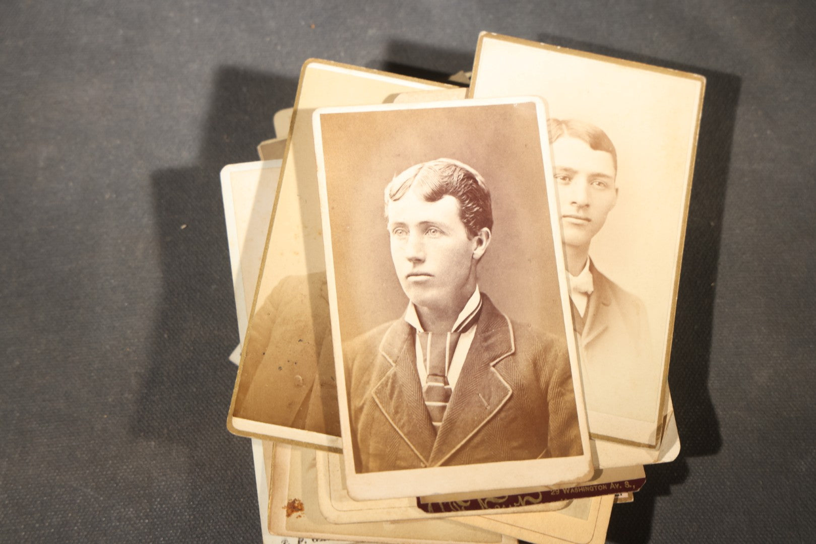 Grouping of 40+ Antique Photographs Including Carte De Visite C.D.V. Portraits, Tintype Photographs, and Board-Mounted Photographs, including young children, women with curled bangs, and more