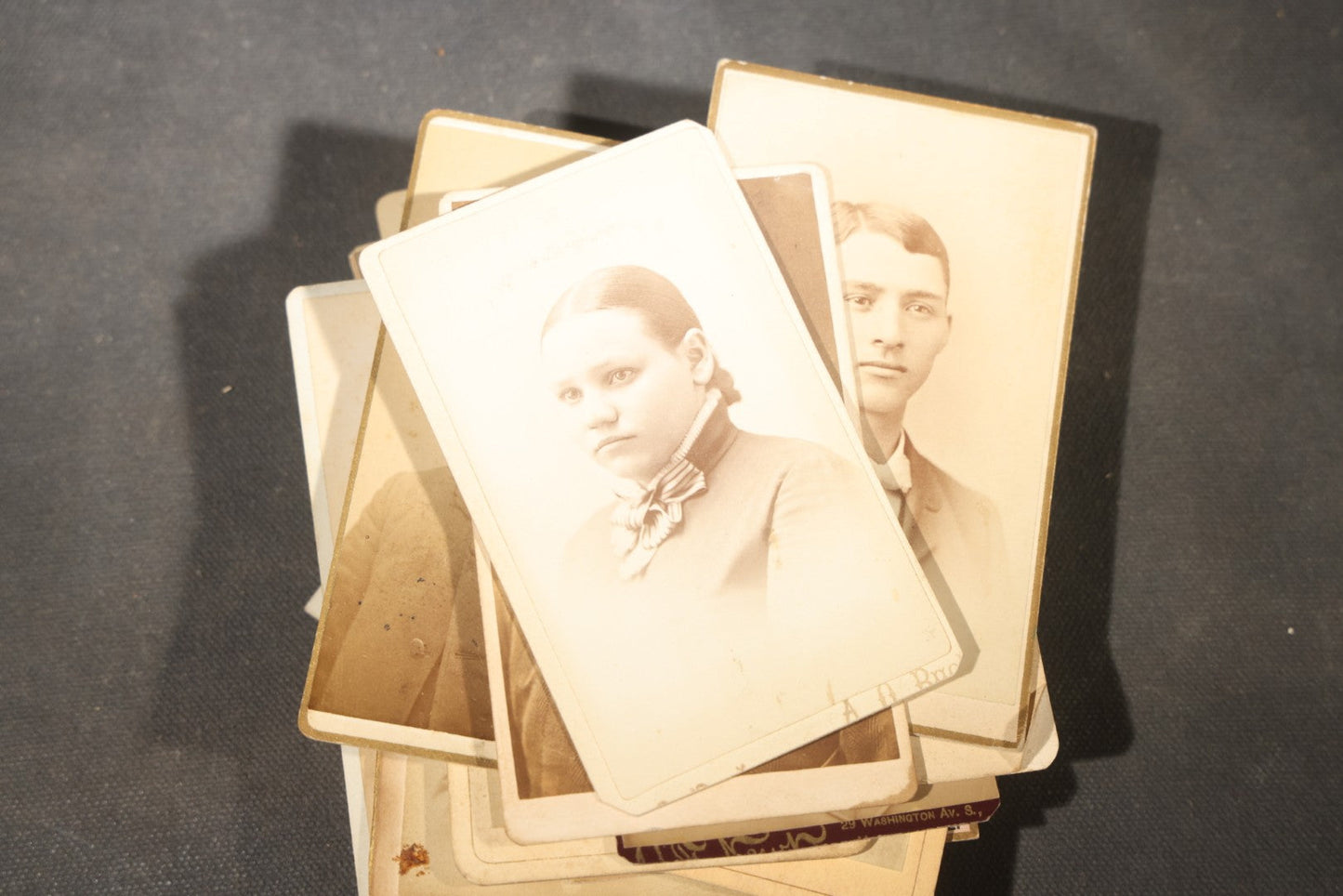 Grouping of 40+ Antique Photographs Including Carte De Visite C.D.V. Portraits, Tintype Photographs, and Board-Mounted Photographs, including young children, women with curled bangs, and more