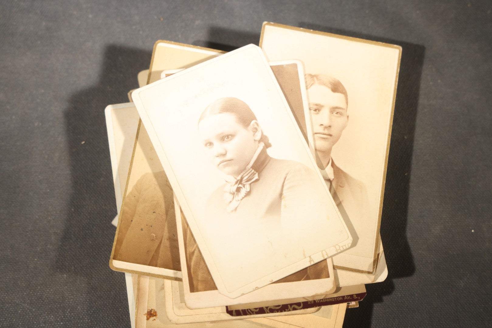 Grouping of 40+ Antique Photographs Including Carte De Visite C.D.V. Portraits, Tintype Photographs, and Board-Mounted Photographs, including young children, women with curled bangs, and more
