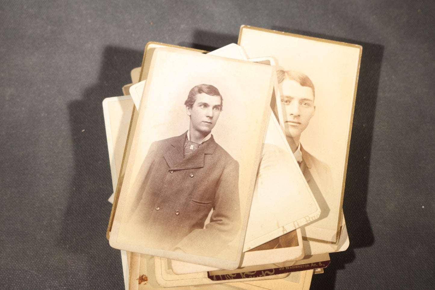 Grouping of 40+ Antique Photographs Including Carte De Visite C.D.V. Portraits, Tintype Photographs, and Board-Mounted Photographs, including young children, women with curled bangs, and more