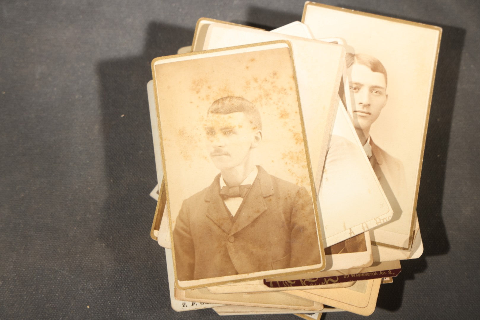 Grouping of 40+ Antique Photographs Including Carte De Visite C.D.V. Portraits, Tintype Photographs, and Board-Mounted Photographs, including young children, women with curled bangs, and more