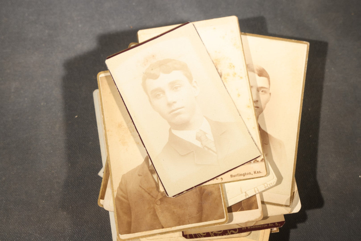 Grouping of 40+ Antique Photographs Including Carte De Visite C.D.V. Portraits, Tintype Photographs, and Board-Mounted Photographs, including young children, women with curled bangs, and more