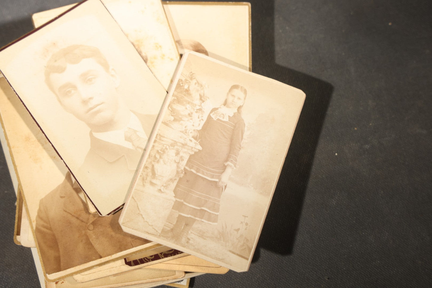 Grouping of 40+ Antique Photographs Including Carte De Visite C.D.V. Portraits, Tintype Photographs, and Board-Mounted Photographs, including young children, women with curled bangs, and more