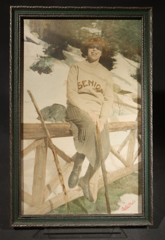 Antique Framed Hand-Colorized Photograph of a Cross-Dressed Man in "Senior" Sweater and Skirt in Snow, Photographed by Capital Studio