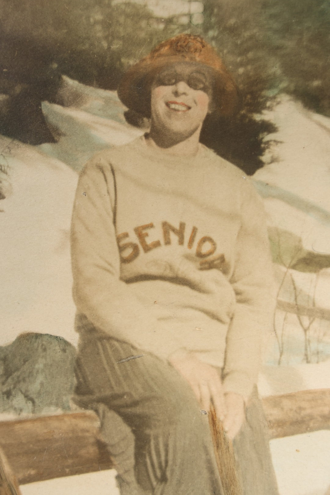 Antique Framed Hand-Colorized Photograph of a Cross-Dressed Man in "Senior" Sweater and Skirt in Snow, Photographed by Capital Studio