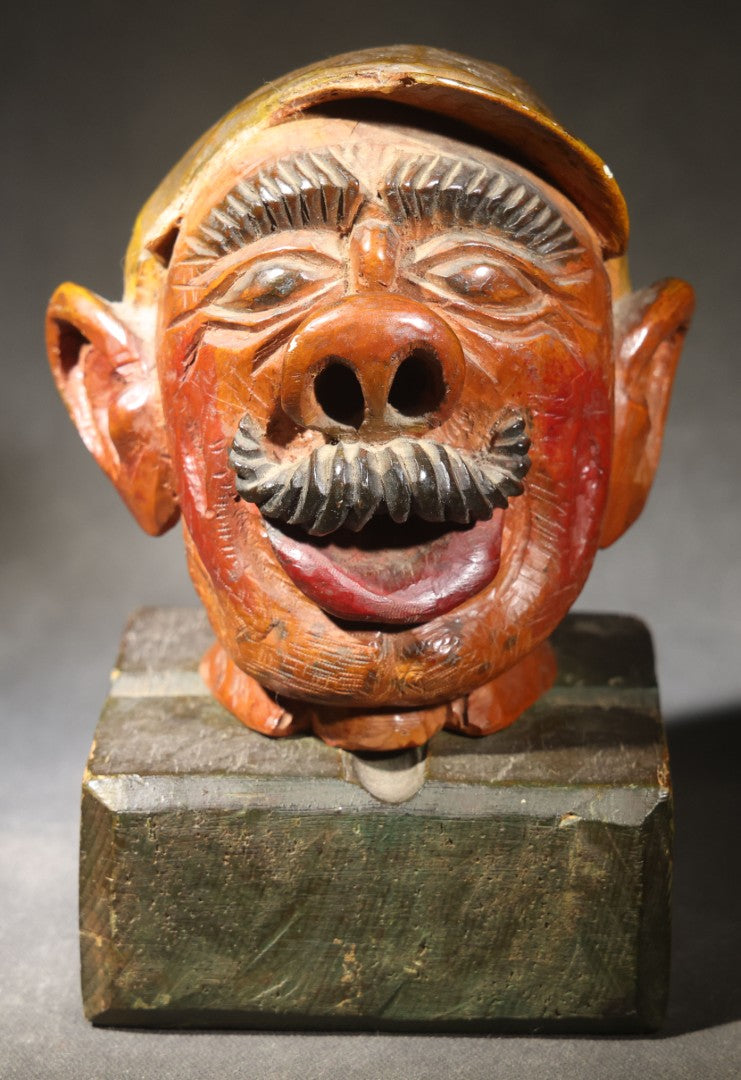 Vintage Folk Art Carved and Painted Wooden Caricature Head of a Mustached Man in a Cap on Removable Block Base, Chip to Hat