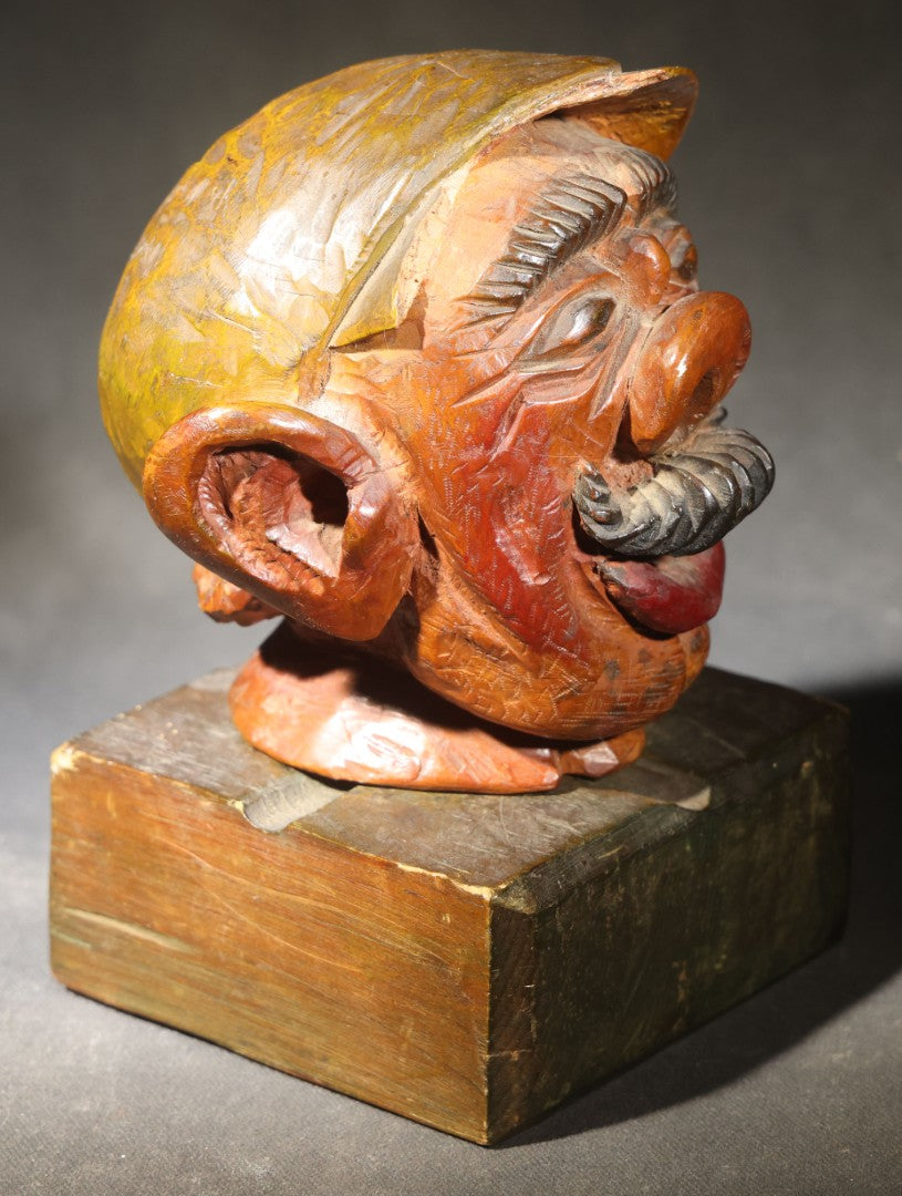 Vintage Folk Art Carved and Painted Wooden Caricature Head of a Mustached Man in a Cap on Removable Block Base, Chip to Hat