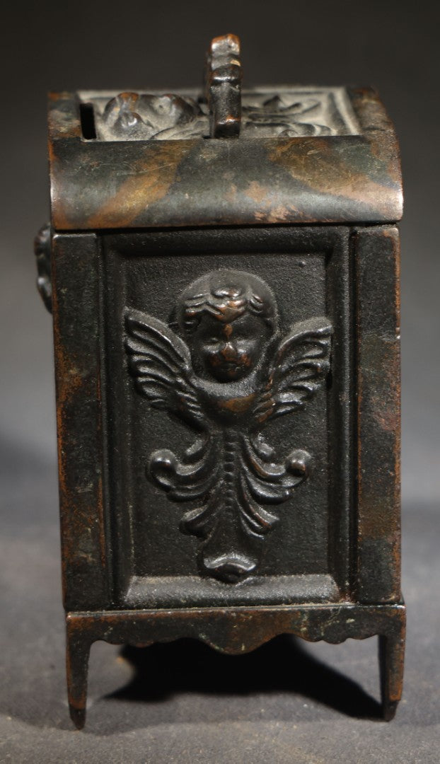 Antique Cast Iron Cherub Still Bank with Winged Putti Panels and Floral Lid Handle, Kenton Brand, Patented August 22, 1911
