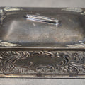 Lot 202 - Antique Silver-Plated Pin Box with Repousse Scrollwork and Floral Lid and Safety Pin Finial , 3" L