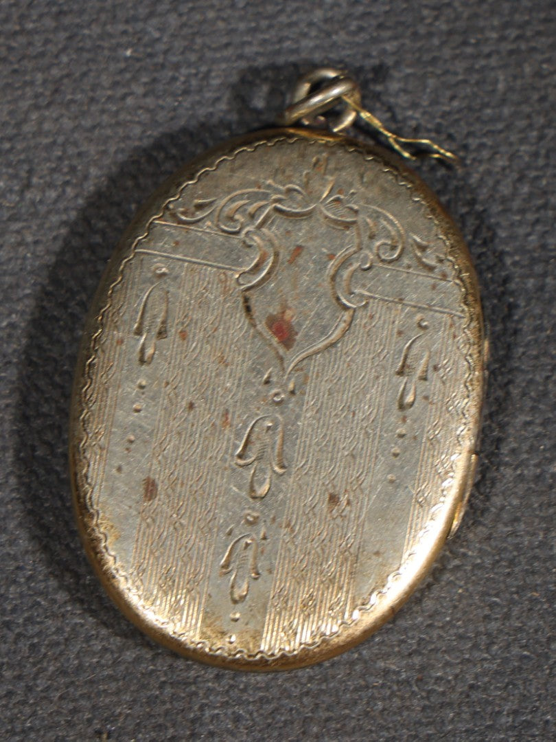 Vintage Oval Locket Pendant with Engraved Monogram, Containing Two Hand-Tinted Portrait Photographs of a Young Man and Young Woman