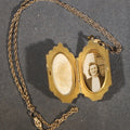 Lot 212 - Vintage Gold-Filled Locket Necklace on Chain with Photograph of a Young Woman and Lock of Blonde Hair, 7/8" W x 1-1/8" H