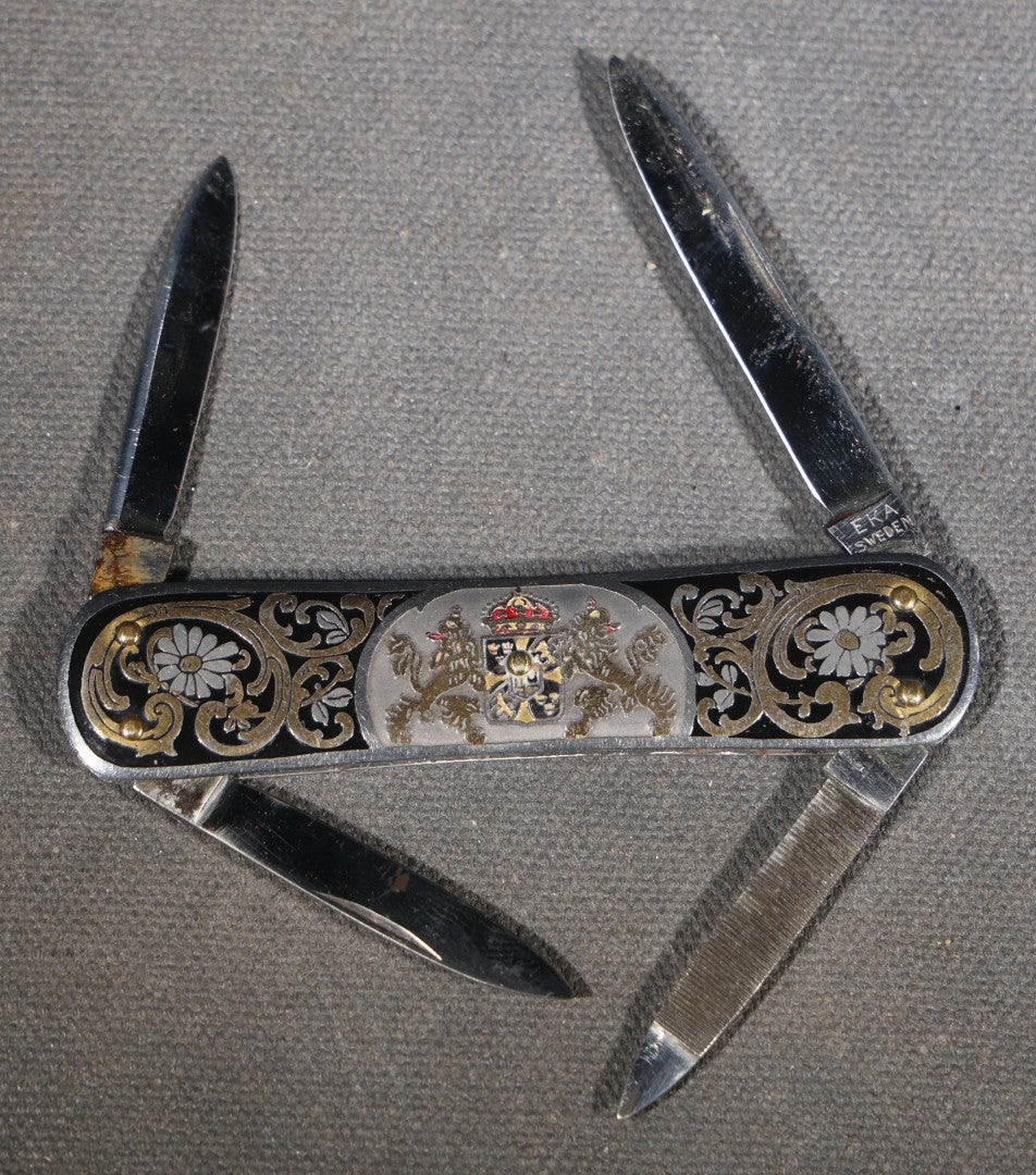 Vintage EKA Sweden Four-Blade Folding Pocket Knife with Damascene Floral Scrollwork and Swedish Coat of Arms, Manufactured by EKA, Eskilstuna, Sweden