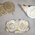 Lot 215 - Trio of Vintage Catholic Automobile Visor Clips Including Saint Christopher Winged Badge, Saint Christopher and Crucifix Three-Panel Badge, and Saint Christopher with Our Lady of the Miraculous Medal