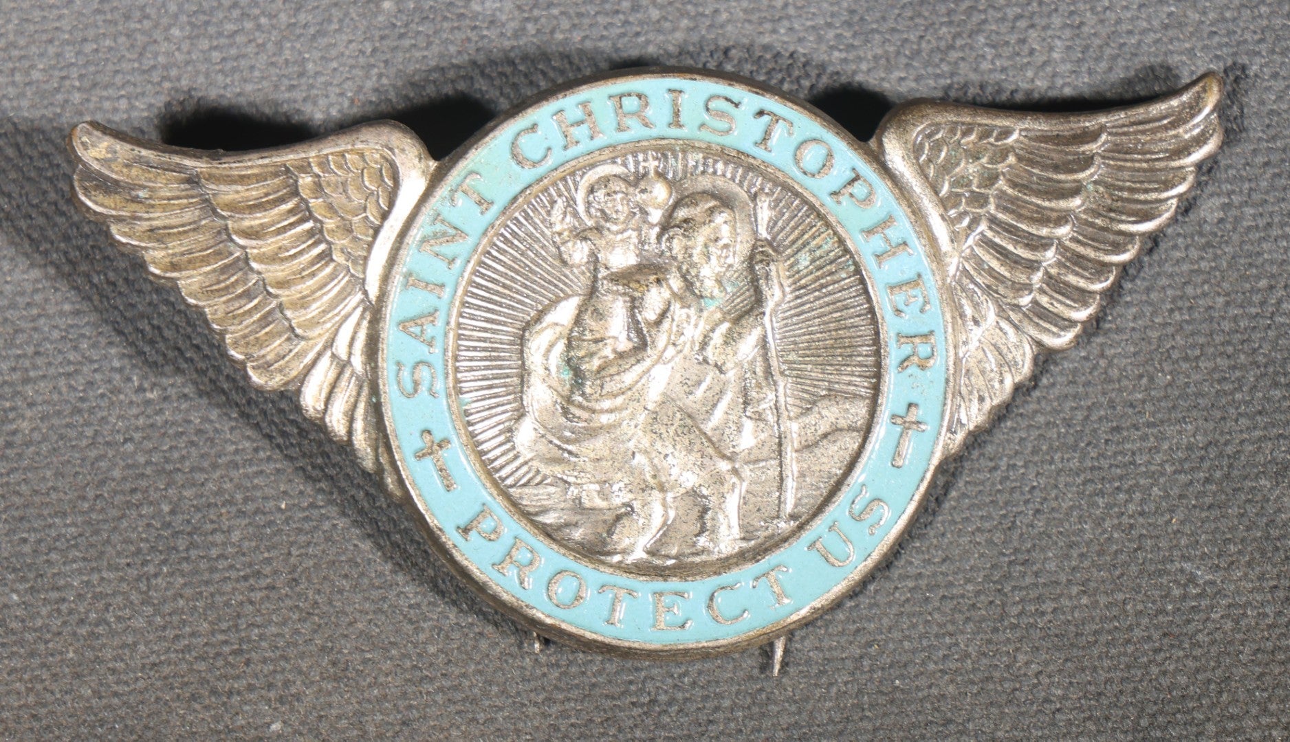 Trio of Vintage Catholic Automobile Visor Clips including Saint Christopher Winged Badge, Saint Christopher and Crucifix Three-Panel Badge, and Saint Christopher with Our Lady of the Miraculous Medal