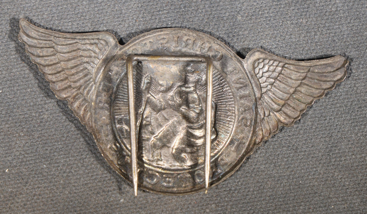 Trio of Vintage Catholic Automobile Visor Clips including Saint Christopher Winged Badge, Saint Christopher and Crucifix Three-Panel Badge, and Saint Christopher with Our Lady of the Miraculous Medal