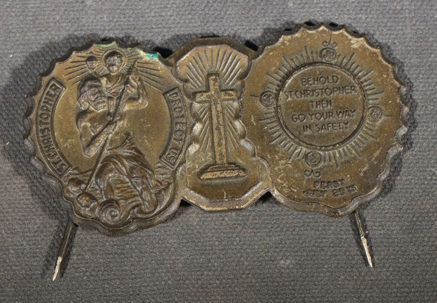 Trio of Vintage Catholic Automobile Visor Clips including Saint Christopher Winged Badge, Saint Christopher and Crucifix Three-Panel Badge, and Saint Christopher with Our Lady of the Miraculous Medal