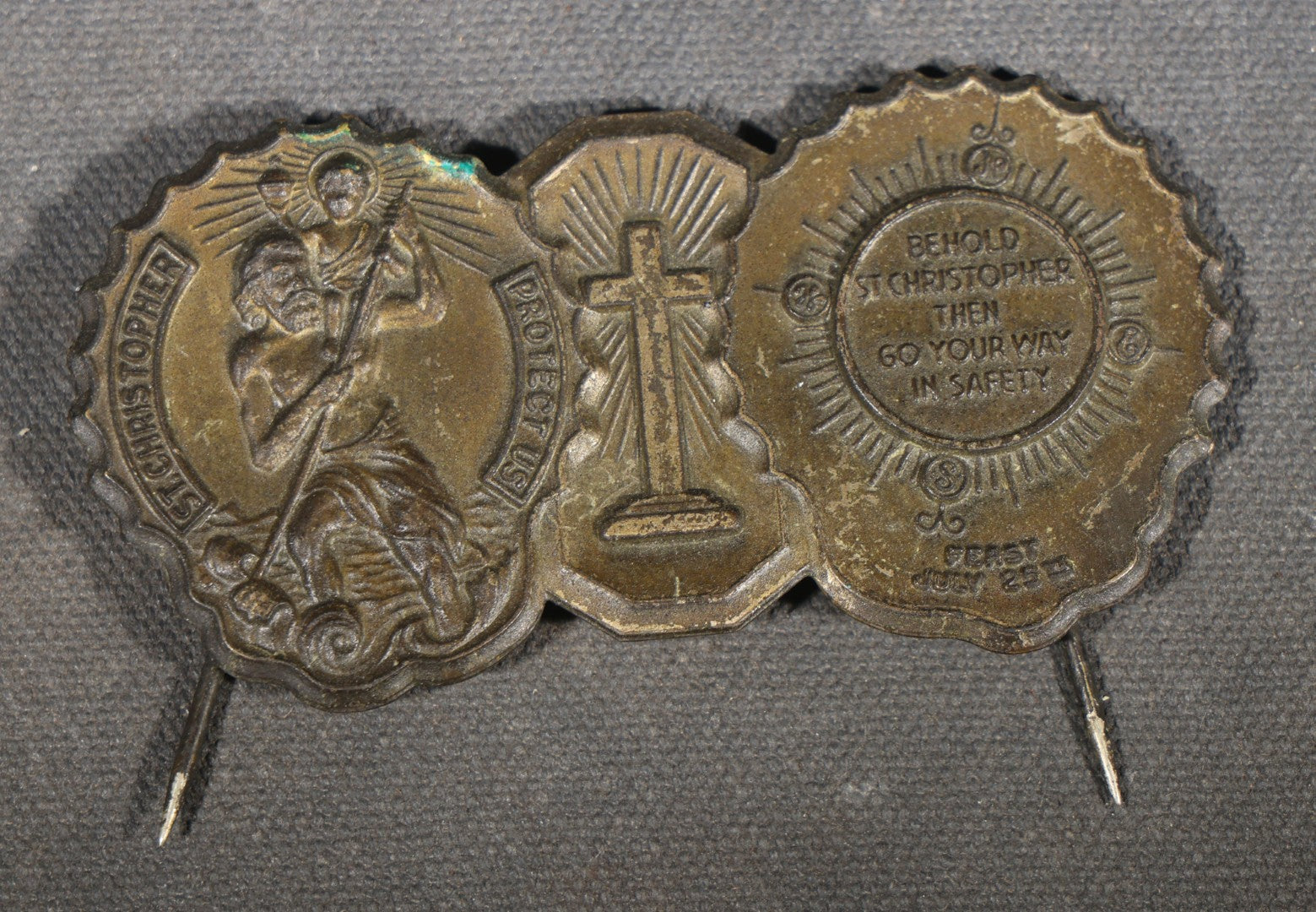 Trio of Vintage Catholic Automobile Visor Clips including Saint Christopher Winged Badge, Saint Christopher and Crucifix Three-Panel Badge, and Saint Christopher with Our Lady of the Miraculous Medal