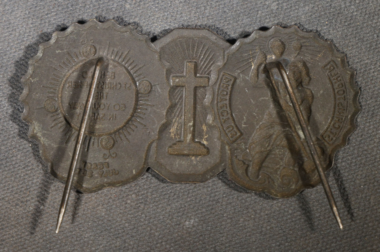 Trio of Vintage Catholic Automobile Visor Clips including Saint Christopher Winged Badge, Saint Christopher and Crucifix Three-Panel Badge, and Saint Christopher with Our Lady of the Miraculous Medal