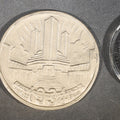 Lot 220 - Trio of Antique and Vintage Commemorative Medallions Including 1934 Chicago Century of Progress Walgreen Drugs, 1939 Dodge Silver Anniversary, and Something Special Scotch Whisky Playing Card Spinner