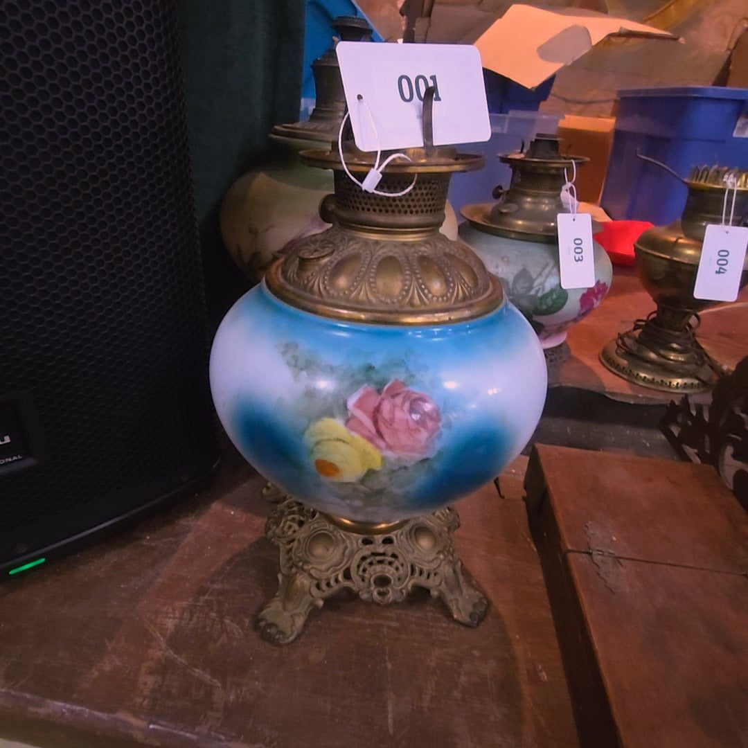 antique kerosene lamp with flowers