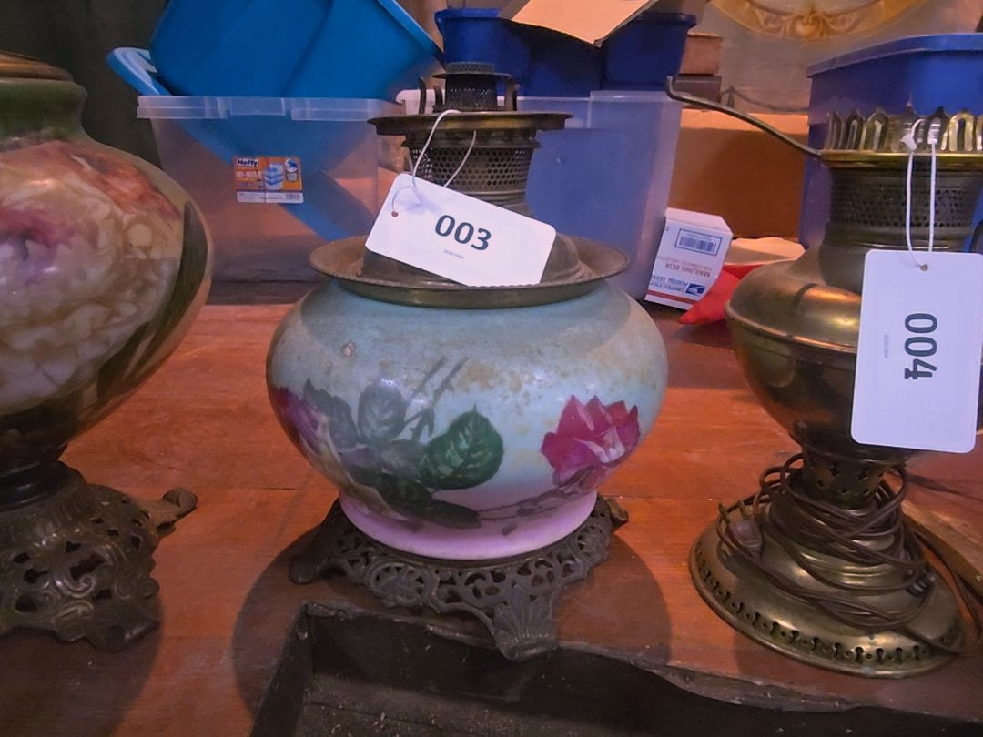 antique kerosene lamp with roses