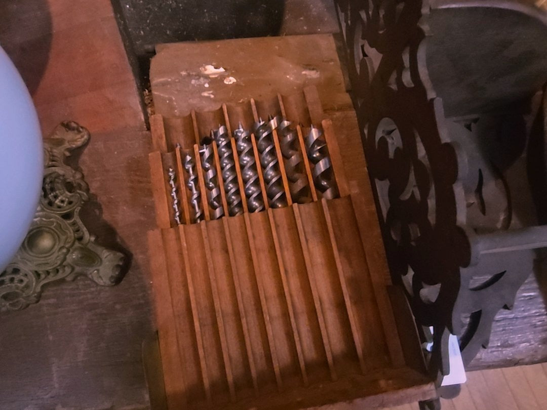 wooden box with drill bits