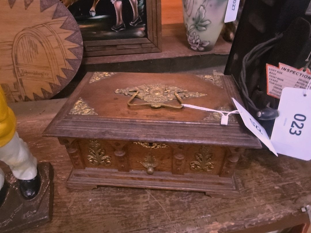 wood box with brass ornamentation and contents