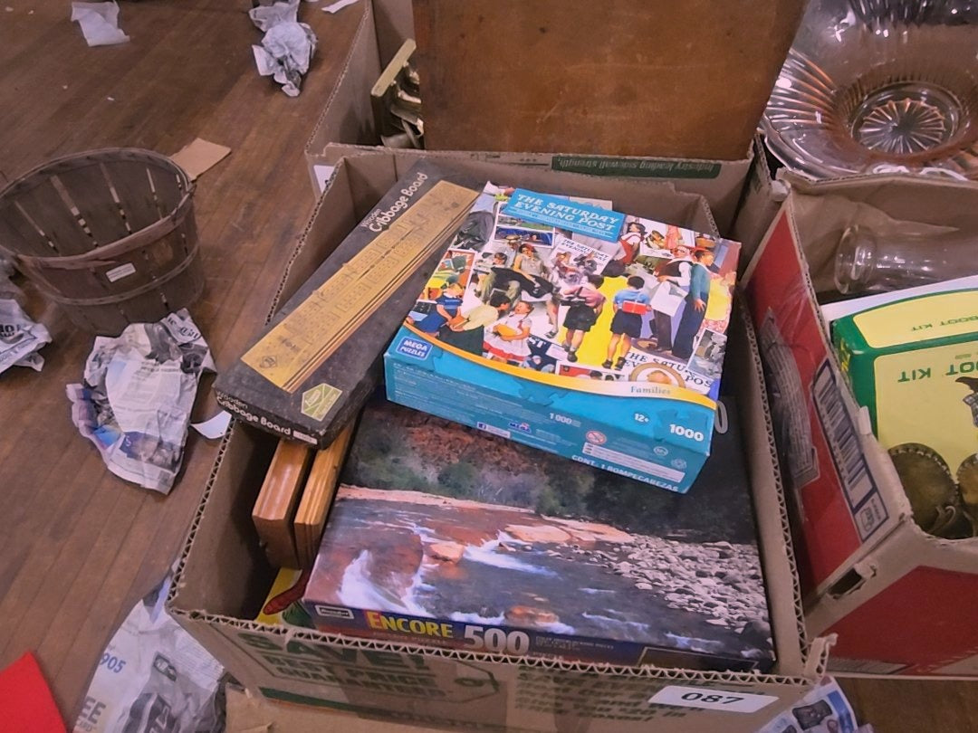 box lot of puzzles and games