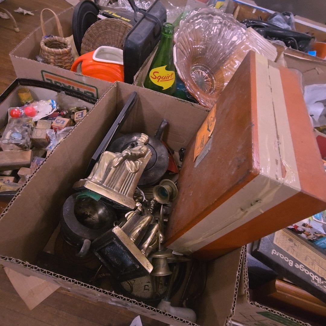 box lot with bookends, metal, and navigational tool