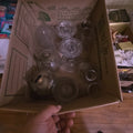 Lot 119 - Box Lot of Clear Glass Including Lamp Chimneys and More