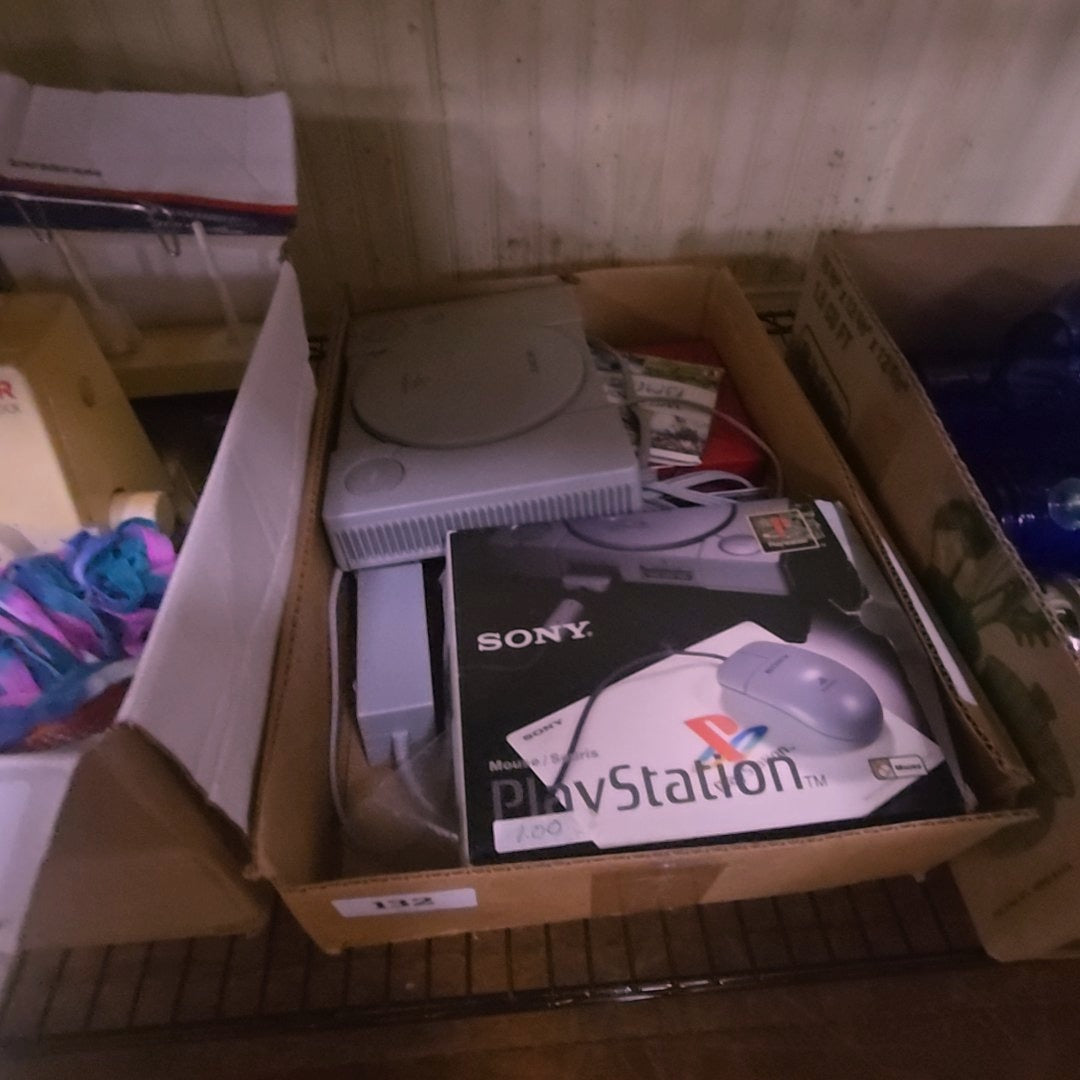 box lot with PlayStation and accessories
