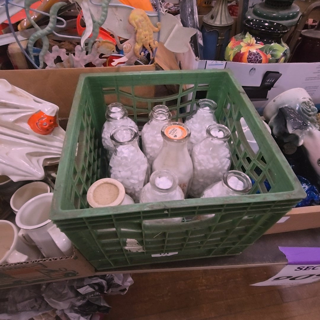 crate lot with milk bottles