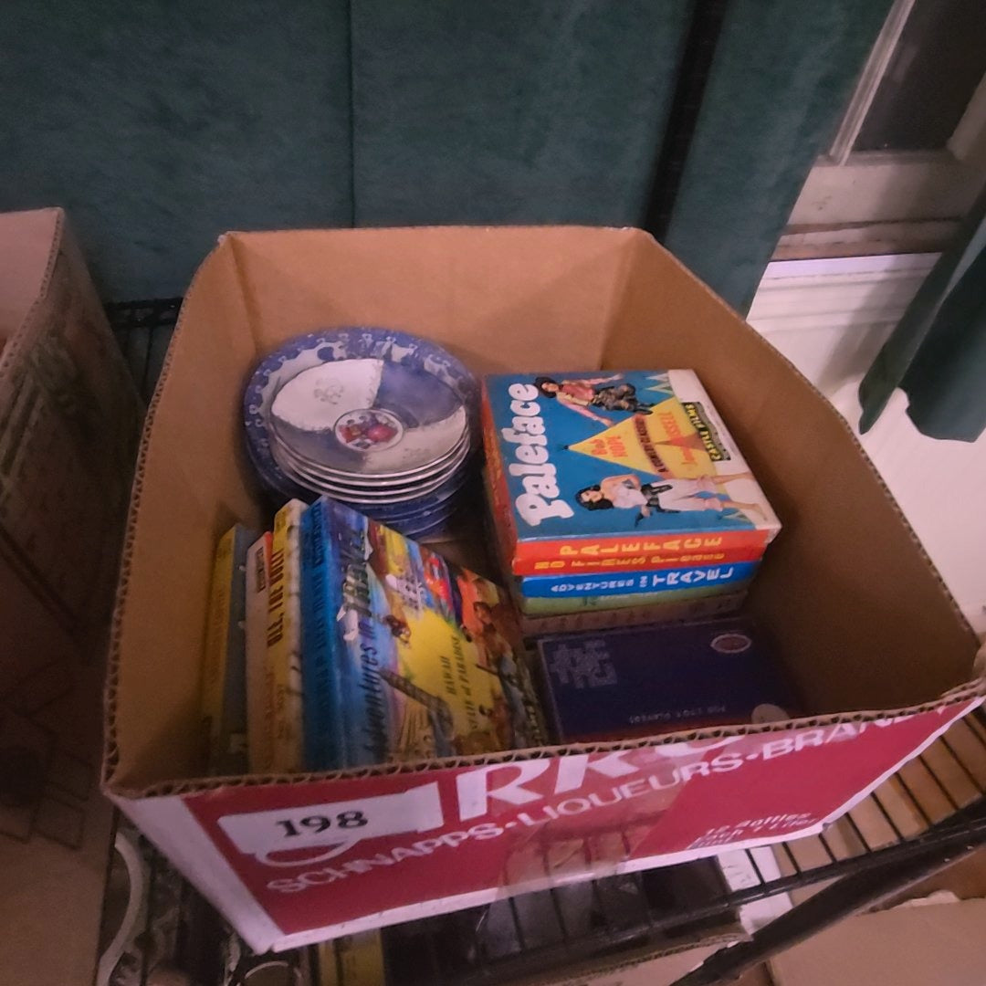 box lot of 8 mm films and porcelain